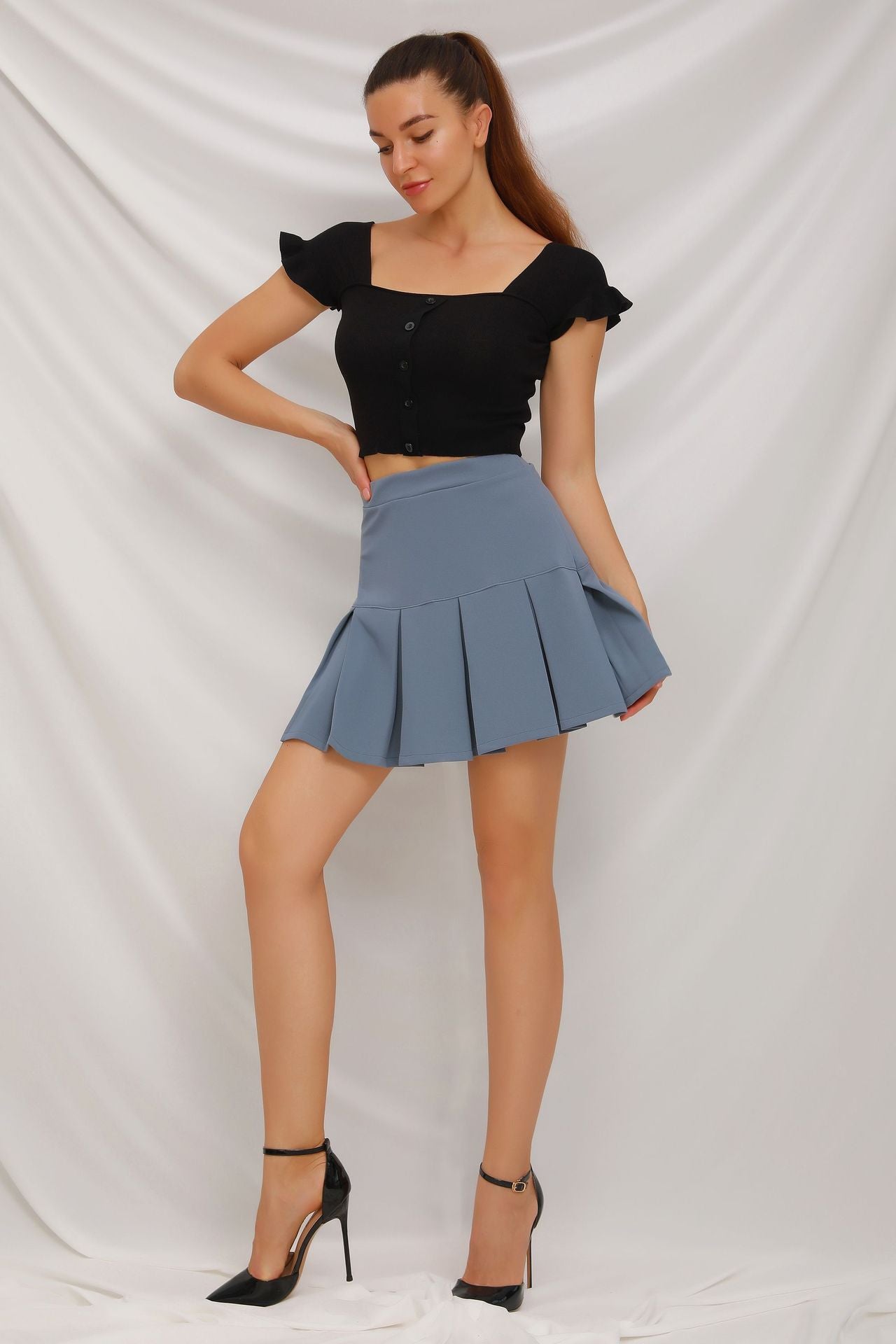 Mini gonna a pieghe a vita alta elastica