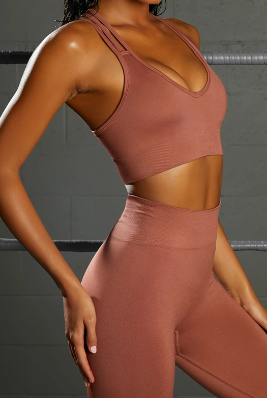 Set sportivo: Reggiseno con incrocio sulla schiena e leggings a vita alta